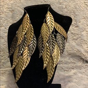 Statement earrings. Gold, platinum color.